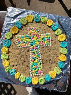 a cake decorated with colorful icing on top of a table