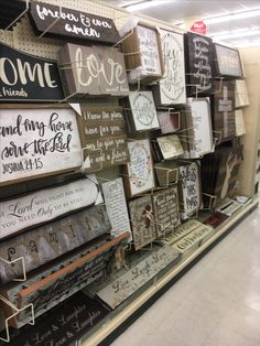 a display in a store filled with lots of different types of greetings and signs