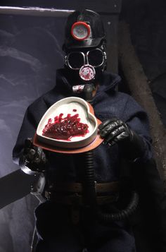 a man in gas mask holding a plate with food on it