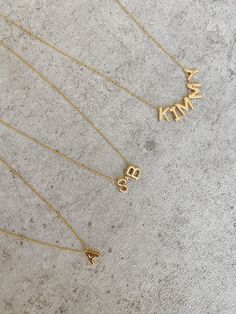 Nothing says luxe like a personalized necklace just for you! This timeless piece makes for the perfect gift that can be worn every day. Personalize with just one initial or with up to five letters. Note: Please Refer to initial placement chart prior to choosing letters. Gold Filled beads can be used as spaces. Measurements: 1.1mm cable chain necklace adjustable up to 18" or 22" Initial Size: 6mm x 8mm Materials: Chain is 14k Gold Filled - Initials: Gold Plated - Beads: 14k Gold Filled ALL CUSTOM Types Of Gold, Cable Chain Necklace, Detailed Jewelry, Gold Bead Bracelets, Custom Necklace, Personalized Necklace, Cleaning Jewelry, Name Necklace, Initial Necklace