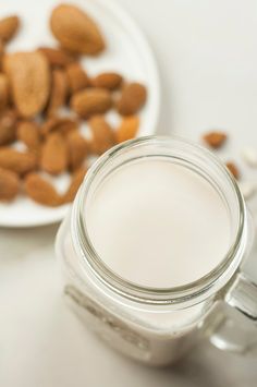 almonds and milk in a glass jar on a table