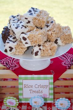 rice crispy treats displayed on a table in front of a red and white checkered tablecloth