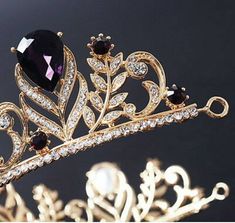 Handmade Bridal Tiaras/Crown Diamond Weight -- 14.10ct Diamond shape -- Round Diamond Cut -- Rose Cut Diamond Color -- Tinted Brown Colour Stone Wt. -- 19.20ct Colour Stone-- Blue Sapphire / Garnet / Green Emerald/ Purple (Lab Created) Metal -- Sterling Silver Silver Purity --92.5% Silver Wt. -- 58.600gm Tiaras Length -- 18inch) Tiaras Finishing Antique/gold Tiaras/Crown All The Diamonds Are Real & Natural This item takes minimum 10 to 14 Days to ship after receiving the payment. Payment WE Elegant Gold Wedding Crown, Elegant Formal Jewelry With Tall Crown, Elegant Tall Gold Crown, Elegant Tall Crown For Party, Elegant Gold Crown With Pinched Shape, Elegant Gold Crown With Rhinestones, Royal Tall Crown For Wedding, Regal Teardrop Crown Jewelry For Party, Regal Tall Crown For Formal Occasions