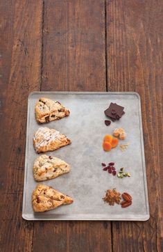 several different types of pastries on a metal tray