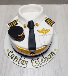 a cake that is shaped like a captain's uniform