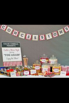 a table topped with lots of candy and confection on it's sides