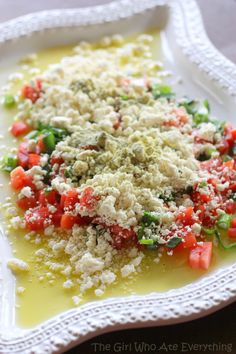 a white plate topped with food on top of a table