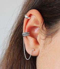 This Leafs Ear Cuff With Chain Earring Set consists of a detailed rose ear cuff (no piercing necessary) , connected by a chain to a 3 mm ball earring. Perfect way to accessorize your ear and up your jewelry game.•DETAILS• All components handmade from  Sterling Silver .• Detailed rose ear cuff measures about 10mm diameter, oxidized to highlight the details;• Ball Stud measures 3mm;• Comes beautiful packaged, in our branded Tiny Jewelry Box. Perfect for gift giving, OR treat yourself!- - - - - - - Conch Piercing Chain, Gold Earring Cuff, Piercing Chain, Silver Earring Cuff, Earrings Cuff, Earring Cuff Chain, Faux Piercing, Tiny Jewelry, Piercing Fake