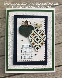 a handmade card with two ornaments on it