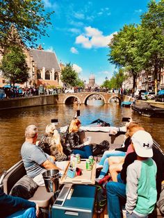 people are sitting in a boat on the water