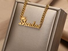 ✨ Unveil a touch of timeless elegance with our Custom Old English Name Necklace. Handcrafted with precision and personalized just for you, this stainless steel pendant on a sleek Cuban chain is not just jewelry; it's a statement piece that speaks volumes about your unique style. 🌟 🔥 Key Features: Customized Old English name pendant for a personalized touch High-quality stainless steel for durability and a lustrous finish Cuban chain design adds a touch of contemporary edge Handmade with love for a one-of-a-kind fashion statement Perfect for parties, events, or as a thoughtful gift for a loved one Make a statement that's as unique as you are. Whether you wear it to a party or gift it to someone special, our Custom Old English Name Necklace is the epitome of personalized fashion. Elegant Personalized Stainless Steel Chain Necklace, Stainless Steel Nameplate Necklace With Adjustable Chain, Elegant Silver Chain Necklace With Custom Name, Elegant Personalized Metal Chain Necklace, Elegant Stainless Steel Nameplate Necklace, Elegant Personalized Metal Name Necklace, Customized Nameplate Chain Necklace, Customized Stainless Steel Nameplate Necklace, Elegant Customizable Metal Necklaces