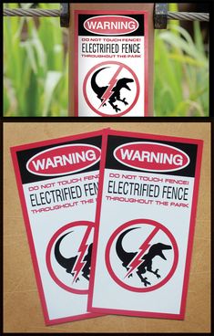 three warning signs are posted on the side of a fence, with grass in the background