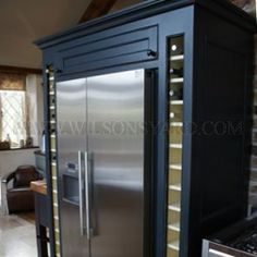 a large stainless steel refrigerator in a kitchen