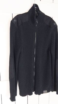 "Nautica Jeans Co black zipper cardigan tunic ribbed sweater/military style cardigan sweater/arm patch sweater/XXL Measurements... taken flat -marked size: XXL/TTG -across chest: 23\" -length: 31\" -shoulder: 20\" Features... -ribbed knit in classic black -100% cotton -nice weight to it -zipper front -military style patches on the elbow and shoulder -longer style Condition... -excellent vintage condition -gently worn TDD3181" Black Ribbed Winter Cardigan, Black Ribbed Outerwear For Work, Black Ribbed Outerwear For Layering, Black Ribbed Outerwear, Black Ribbed Knit Outerwear, Ribbed Knit Black Outerwear, Black Zipper Closure Casual Cardigan, Casual Sweater With Zipper Closure For Cold Weather, Black Knit Outerwear With Ribbed Collar