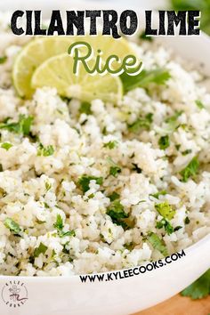 a white bowl filled with rice and garnished with cilantro limes