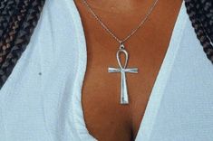 🤎 This listing is for a silver toned ankh necklace. 🤎 Necklace is handmade and constructed with hypoallergenic materials free of lead and nickel.  🤎 Chain is 18" long and hangs about 9" long. 🤎 Check out my listing for the matching earrings. https://www.etsy.com/listing/1007289711/silver-ankh-earrings?ref=shop_home_active_18 🤎 Each order is prepared and wrapped with love, just for you. 🤎 Care:  To care for your jewelry, store in pouch when not in use.  To clean the charm, create a paste us Ankh Necklace Silver, Bohemian Ankh Necklace In Metal, Adjustable Silver Ankh Necklace, Bohemian Silver Ankh Jewelry, Bohemian Ankh Silver Jewelry, Silver Ankh Cross Necklace Spiritual Style, Silver Ankh Cross Necklace In Spiritual Style, Silver Ankh Cross Spiritual Necklace, Ankh Earrings