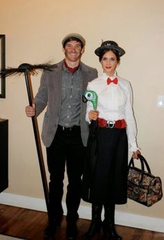 a man and woman dressed up in costumes