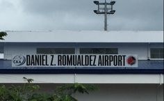 a sign on the side of a building that says daniel z romaldez airport