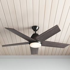 a ceiling fan mounted to the side of a wooden ceiling in a room with white walls