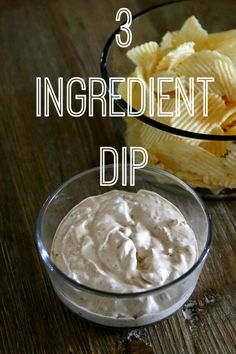 three ingredient dip in a glass bowl on a wooden table next to a container of chips