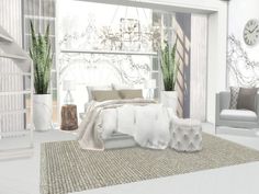 a bedroom with white furniture and large windows