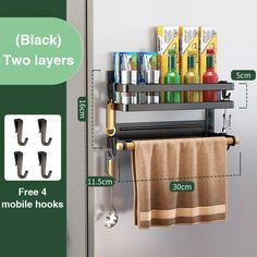 two layers towel rack with hooks for towels and other bathroom items on the wall next to it