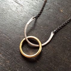 This simple necklace resembles a horse shoe and serves as a ring holder. I had a request from a massage therapist, she wanted a necklace that she could hang her wedding ring from so she could have her hands free. Hammered sterling is united by oxidized sterling chain. Great on it's own or with long layers. (RING IN 2ND PHOTO NOT INCLUDED) 1" wide, 16" sterling chain Wedding Ring Necklace Holder Men, Wedding Ring Holder Ideas, Ring Holder Ideas, Colours For Wedding, Ring Necklace Holder, Wedding Ring Necklace Holder, Silicon Rings, Wedding Ring Necklace, Wedding Ring Holders