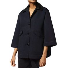 This Elegant Jacket Is Effortlessly Easy To Style. Built From A Breathable Cotton Mix, Its Feminine Silhouette Lends Versatile Appeal. The Garment Features A Button-Up Closure And Two Button Pockets. The Wide, Cropped Sleeves And Pvc Collar Add An On-Trend Touch. 82%Cotton 18%Polyester, Contrast 59%Wool 22%Polyester 19%Polyurethane. Button Closure. 2 Pockets. Unlined. Model Is Wearing A Size S And Is 177 Cm / 5'9". Fits True To Size, Take Your Normal Size. Color: Blue Chic Navy Wool Outerwear, Modern Blue Outerwear For Office, Designer Blue Outerwear With Padded Collar, Designer Navy Outerwear With Pockets, Chic Navy Outerwear With Lapel Collar, Designer Navy Single-breasted Outerwear, Designer Navy Outerwear For Work, Navy Padded Collar Outerwear For Fall, Chic Blue Wool Outerwear