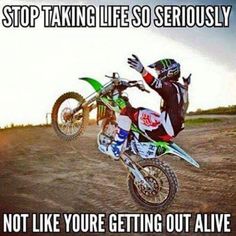 a person on a dirt bike doing a trick in the air with caption that reads, stop taking life so seriously not like you're getting out alive