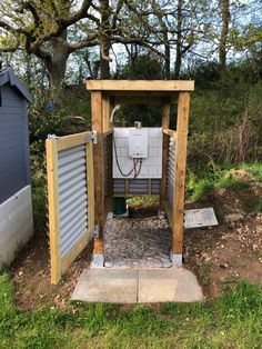 an outdoor shower in the middle of a yard