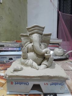 an elephant statue sitting on top of a table