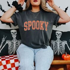 👻 Spooky - Comfort Colors Unisex TShirts 👻 Get ready for all things spooky with our "Spooky" shirt! Perfect for celebrating Halloween and embracing the eerie vibes. Features: Spooky "Spooky" design with a touch of eerie charm 🎃🕸️ Soft and comfy fabric for hauntingly good comfort 👕 Ideal for Halloween parties, haunted houses, or just getting into the spirit of the season 👻🦇 Embrace the spooky season with style! #SpookySeason #HalloweenFashion #EerieVibes #SoftAndComfy #HauntinglyGood #Chic Spooky Black T-shirt For Fall, Spooky Halloween T-shirt With Graphic Print, Trendy Halloween Crew Neck T-shirt, Spooky Pre-shrunk T-shirt For Fall, Trendy Halloween Text Print T-shirt, Grunge Fall T-shirt With Text Print, Grunge T-shirt With Text Print For Fall, Grunge Text Print T-shirt For Fall, Halloween Grunge T-shirt With Text Print