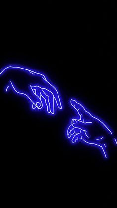 two hands touching each other in the dark with neon lights on it's sides