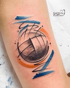 a tattoo on the arm of a person with an orange and blue circle around it