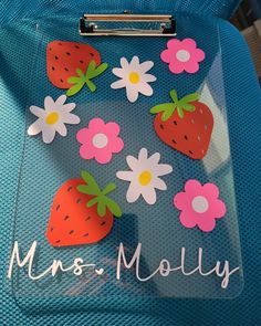 a piece of luggage with strawberries and daisies on the side that says miss moly