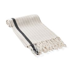 a white and black striped blanket with fringes on the ends, laying flat in front of a white background