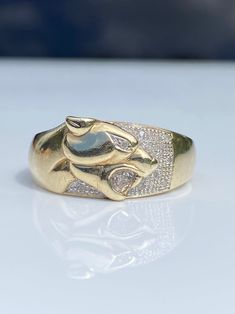 ~ Here we have a beautiful leopard/ panther design ring in yellow gold set with little diamonds  ~ 9ct gold hallmarks to inner and also stamped 'Dia' for diamonds  ~ In excellent condition, light wear in keeping with age and use, any dark areas seen in photos are reflections or shadows, not tarnish or patina  ~ Size measures as a U.K T or US a touch over 9.5 but a wider band, so depending on finger shape or preferred fit might feel a touch smaller, so perhaps suit S.5 / 9.25 ~ Rong face north to Panther Design, Gold Hallmarks, Panther Ring, Yellow Gold Setting, Wide Bands, Gold Set, Rings Statement, Panther, Ring Designs