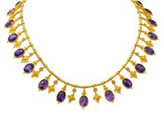 Braided chain necklace is strung with deeply ridged barrel links alternating with drops Drops consist of bezel set amethysts topped by a clover motif alternating with floral quatrefoils Amethysts are oval cut and slightly vary in size measuring approximately 9.5 x 6.5 mm Very well matched in saturated violetish purple Locket Bracelet, Gold Fringe, Vintage Fine Jewelry, Amethyst Gold, Antique Necklace, Amethyst Jewelry, Victorian Jewelry, Collar Necklace, Estate Jewelry