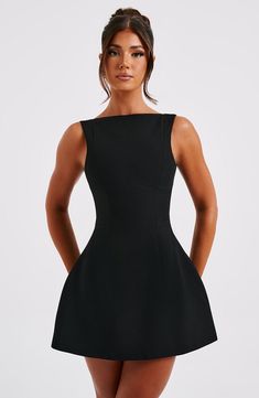 The ultimate LBD, Alana is made in our premium crepe fabric with a flirty bubble shape skirt which is super voluminous. The high neck design is finished with seam details and a scoop back. Pair with sleek waves and tonal mule heels. 



Colour: Black.

Premium non-stretch crepe fabric.

Fully lined.

Seam detail.

Scoop back.

Bubble shape, voluminous skirt.

High, boat shape neckline.

Mini length.

Model is an XS and is wearing an XS.

 Size: XS, S, M, L, XL, XXL Backless Dress Summer, Backless Tank Top, Mode Tips, Elegant Mini Dress, Backless Bodycon Dresses, High Neck Designs, Maxi Dress Sale, Sleeveless Short Dress, Backless Mini Dress