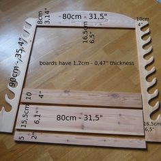 two wooden frames sitting on top of a hard wood floor with measurements for each frame