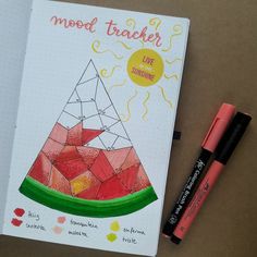 a notebook with an image of a watermelon and the words mood tracker on it