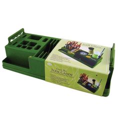 a green box with utensils in it