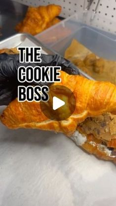 there is a croissant that has been cut in half with the words the cookie boss on it