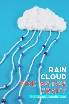 a white cloud with blue beads on it and the words rain cloud fine motor craft