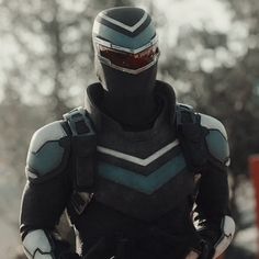 a man dressed in black and blue armor