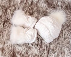 White hand knitted baby fur pom pom hat, Faux fur booties, Baby winter clothes, Baby shower gift, Gender neutral Newborn outfit, Preemie set Every item of this set might be purchased separately as well. These white crochet baby booties and cable knit hat are made with soft acrylic yarn ((super soft, NO itchiness. Great set for baby's first photos and it is perfect for a baby shower or new baby gift. * * * Sizes * * * Preemie Head Circumference: 27 - 30,5 cm / 10.5 - 12 inches Foot length: 7 cm / White Crochet Hat For Winter Gift, Winter White Crochet Hat As Gift, White Handmade Crochet Hat For Winter, White Hand Knitted Crochet Hat For Winter, White Hand-knitted Crochet Hat For Winter, Neutral Newborn Outfit, Baby Winter Clothes, Baby Fur, Fur Pom Pom Hat