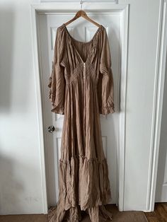 Plus Size Tan color linen gauze rental dress. Fits maternity and non-maternity XL-3XL. I will ship to you a few days before your scheduled shoot. You will have rental for 7 days. You are responsible for return shipping.  Not to be worn for an actual event such as a baby shower or wedding.  Lift gown as much as possible while moving around and place down for pictures in order to reduce damage to dress. Please message me to verify that your date is available before placing order.  Add your date in Summer Maternity Dress In Beige, Bohemian Linen Maxi Dress With Ruffles, Summer Beige Maternity Dress, Flowy Maxi Maternity Dress For The Beach, Flowy Maxi-length Maternity Dress For Beach, Flowy Maternity Maxi Dress For Beach, Flowy Maxi Length Maternity Dress For The Beach, Flowy Bohemian Maternity Dress For Spring, Flowy Beige Linen Maxi Dress