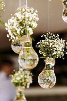 hanging glass vases filled with baby's breath flowers