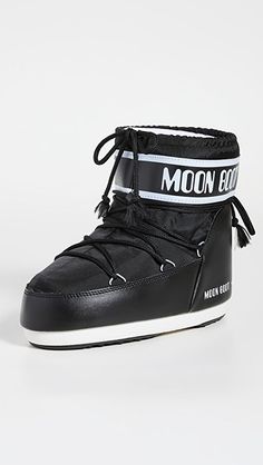 Moon Boots CLASSIC LOW 2 BOOT | SHOPBOP Moon Boot, Ski Fashion, Drawstring Top, Low Boots, Moon Boots, Wool Beanie, Fur Pom Pom, Fox Fur, Logo Graphic