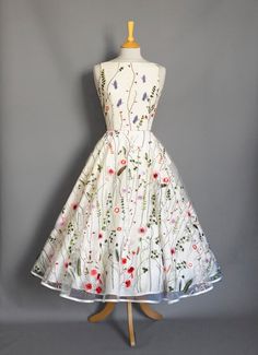 Whimsical Wedding Dress With Floral Embroidery, Whimsical Floral Embroidery Wedding Dress, Whimsical White Wedding Dresses, Floral Embroidery Dress For Wedding Garden Party, Whimsical Floral Print Wedding Dress, Floral Embroidered Dress For Wedding Garden Party, Floral Embroidered Dress For Garden Wedding, Whimsical White Floral Print Dress, Sabrina Wedding Dress